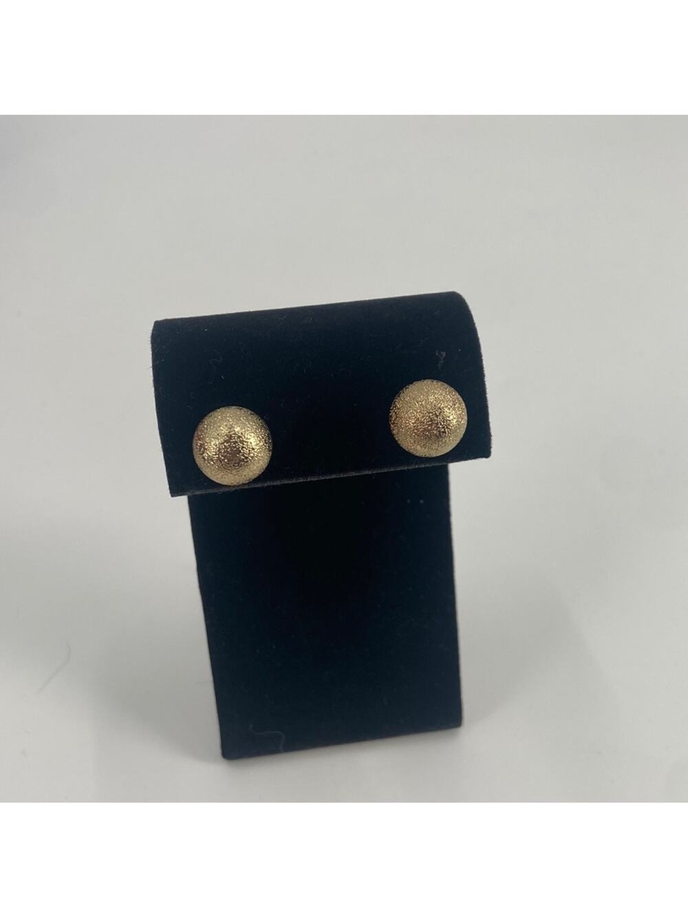 Gold tone textured stud earrings